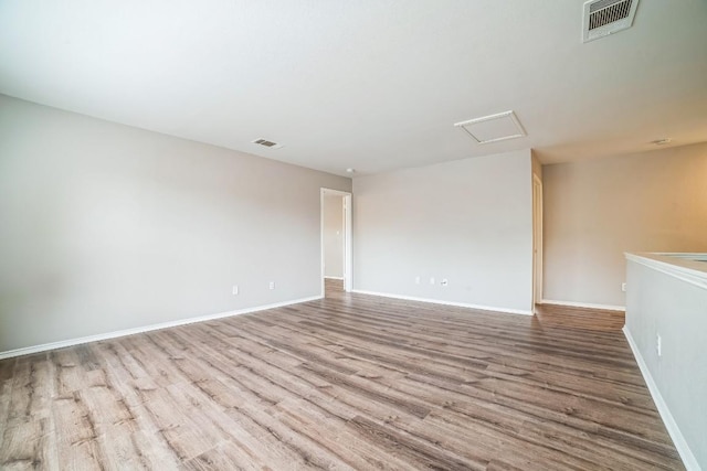 spare room with light hardwood / wood-style flooring