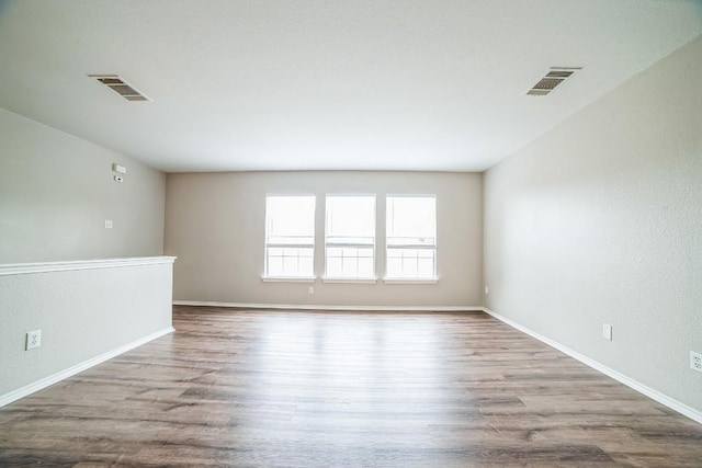 spare room featuring light hardwood / wood-style floors