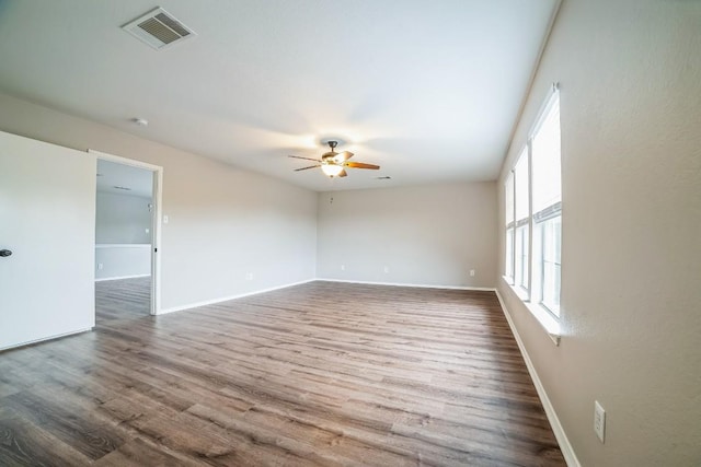 unfurnished room featuring hardwood / wood-style flooring and ceiling fan