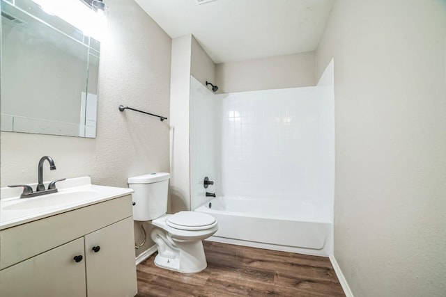 full bathroom featuring shower / tub combination, vanity, hardwood / wood-style flooring, and toilet