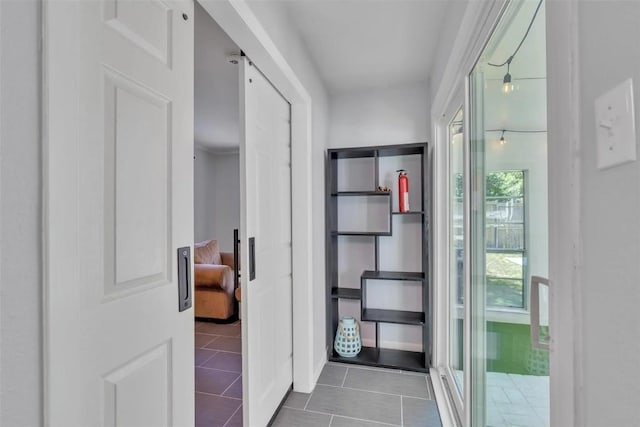 hall featuring tile patterned floors