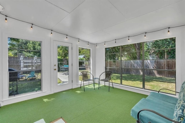 unfurnished sunroom with a wealth of natural light