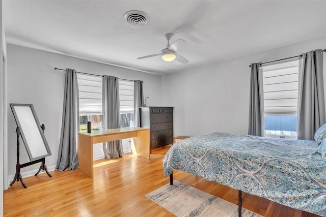 bedroom featuring hardwood / wood-style flooring and ceiling fan