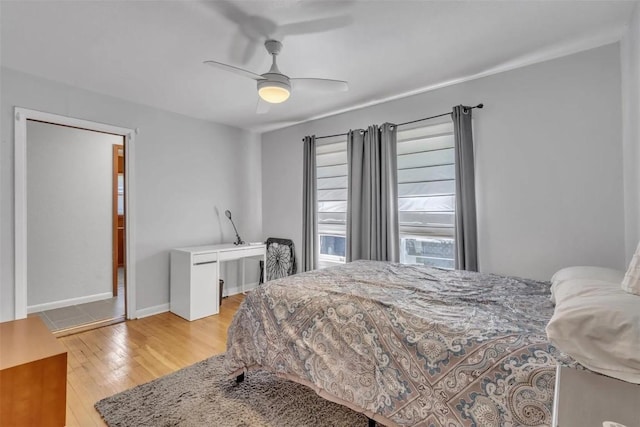 bedroom with ceiling fan and light wood-type flooring