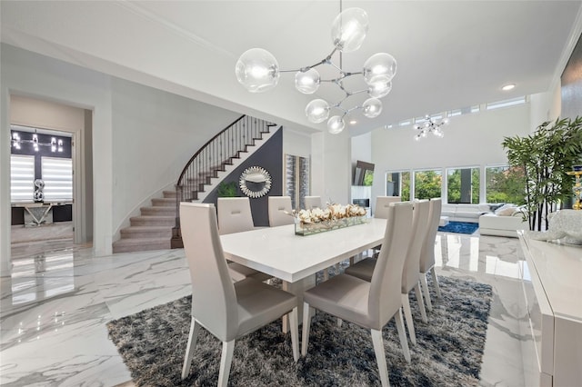 dining room featuring ornamental molding and a notable chandelier