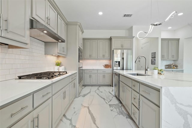 kitchen featuring gray cabinetry, sink, and stainless steel appliances