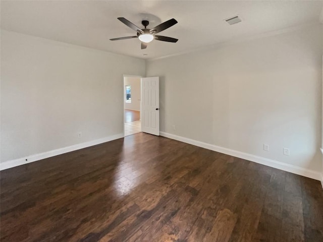 spare room featuring dark hardwood / wood-style floors and ceiling fan