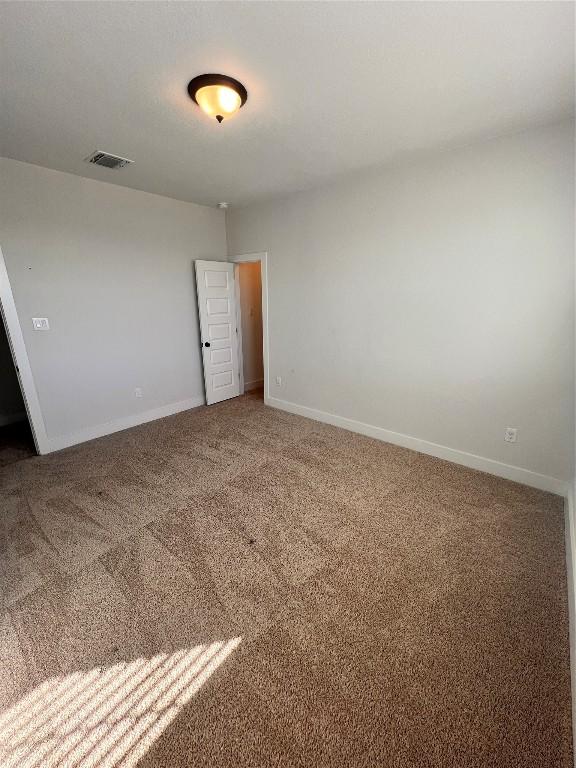 spare room with carpet