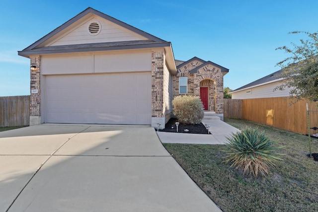 ranch-style home featuring a garage