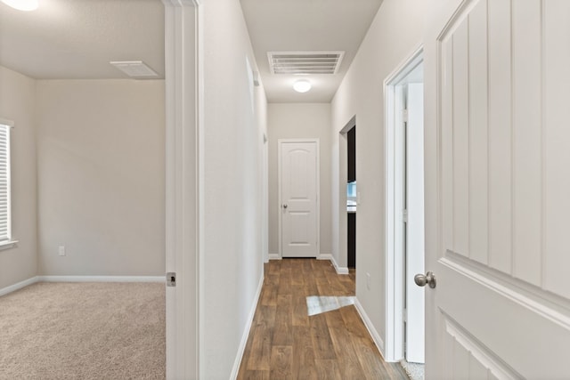 hall featuring wood-type flooring