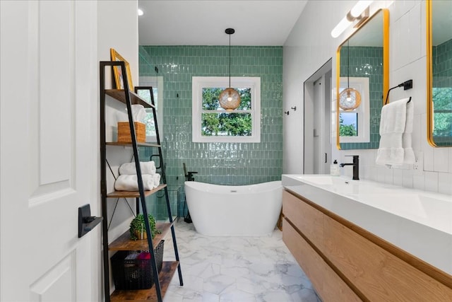 bathroom with vanity, tile walls, and independent shower and bath