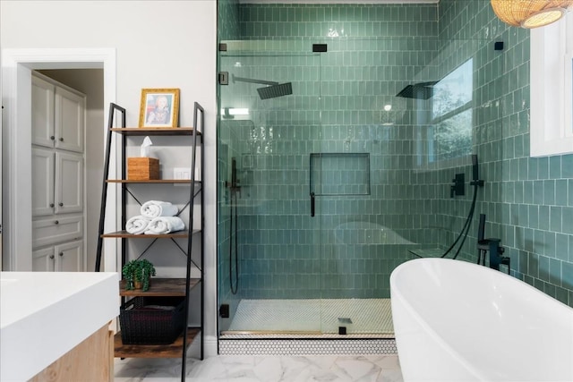 bathroom featuring vanity and separate shower and tub