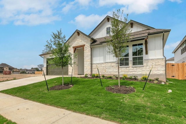 view of front of home featuring concrete driveway, board and batten siding, stone siding, and an attached garage