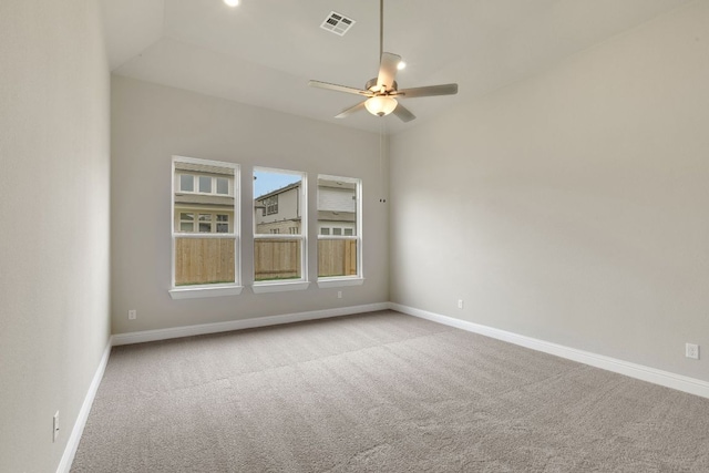 empty room with carpet flooring, baseboards, and a ceiling fan