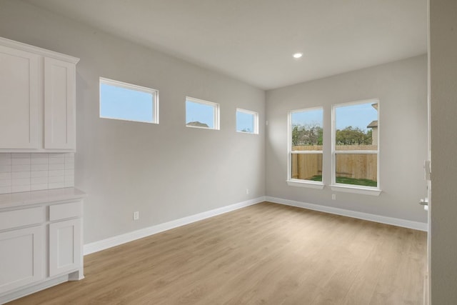 2921 Zuni Path, Leander, TX 78641 - empty room featuring light wood-style flooring and recessed lighting