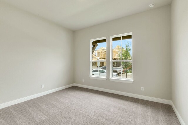 2921 Zuni Path, Leander, TX 78641 - spare room featuring carpet floors and a smoke detector