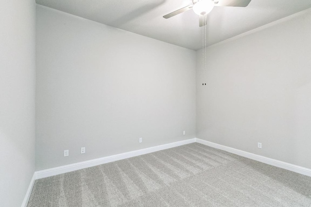 unfurnished room with carpet, baseboards, and ceiling fan