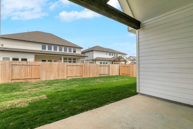 view of yard with a patio area and a fenced backyard