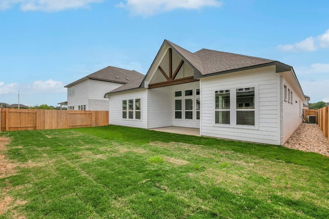 2921 Zuni Path, Leander, TX 78641 - rear view of property with a fenced backyard, a patio, and a shingled roof