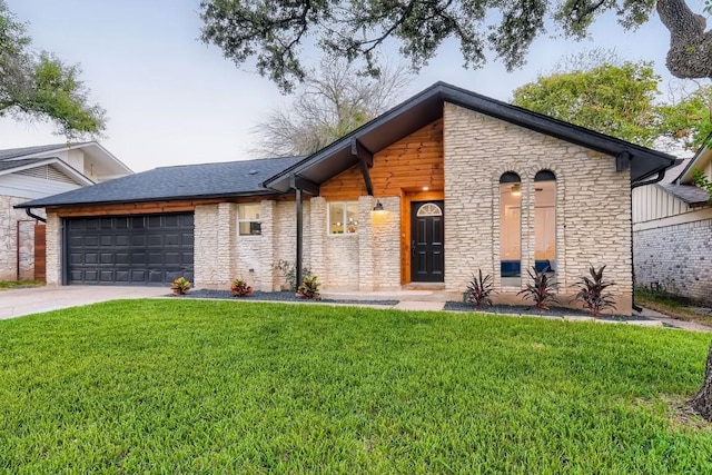 view of front of house with a front yard and a garage