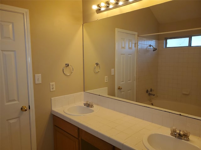 bathroom with shower / bathing tub combination and vanity