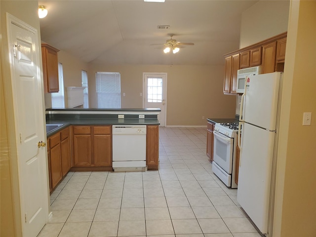 kitchen with white appliances, light tile patterned flooring, ceiling fan, and lofted ceiling