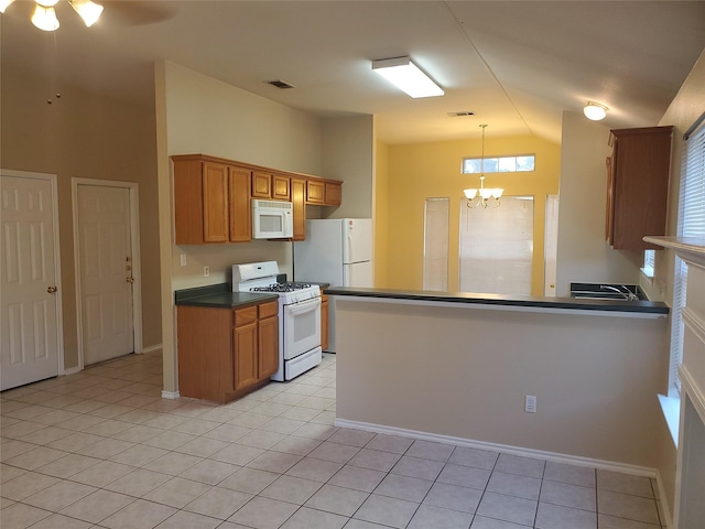 kitchen featuring white appliances, light tile patterned flooring, kitchen peninsula, ceiling fan with notable chandelier, and pendant lighting