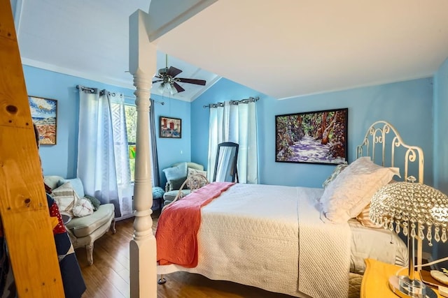 bedroom featuring ceiling fan, dark hardwood / wood-style floors, and vaulted ceiling