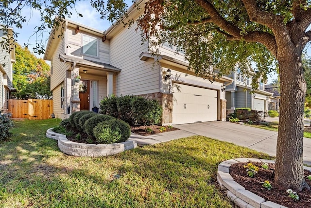 view of front of home featuring a front lawn and a garage