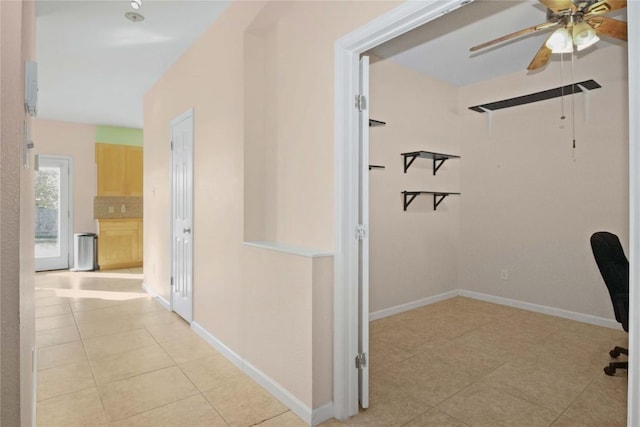 corridor featuring light tile patterned flooring