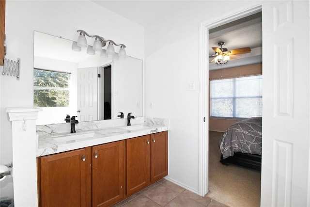 bathroom featuring tile patterned floors, ceiling fan, vanity, and a healthy amount of sunlight