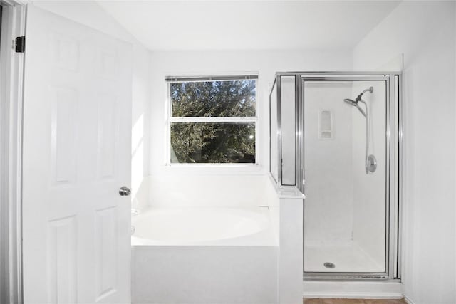 bathroom with plus walk in shower and vaulted ceiling