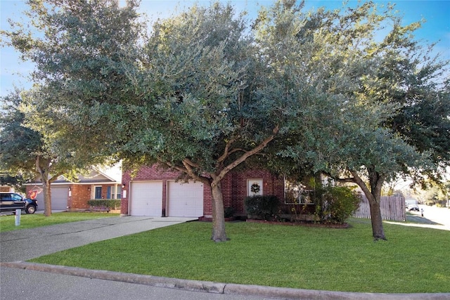 obstructed view of property featuring a front lawn and a garage