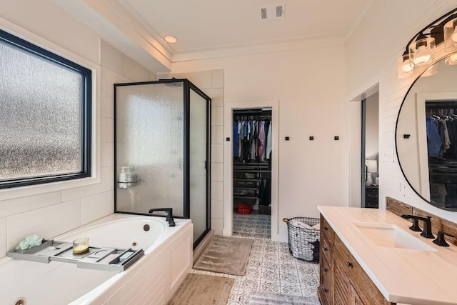 bathroom featuring independent shower and bath, a healthy amount of sunlight, and crown molding