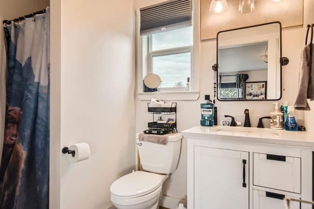 bathroom featuring vanity and toilet