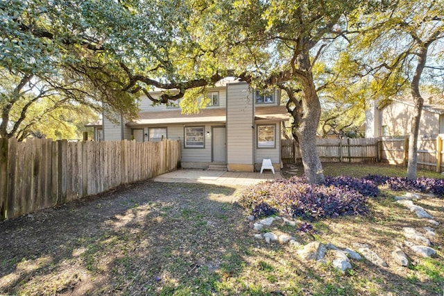 rear view of property featuring a patio