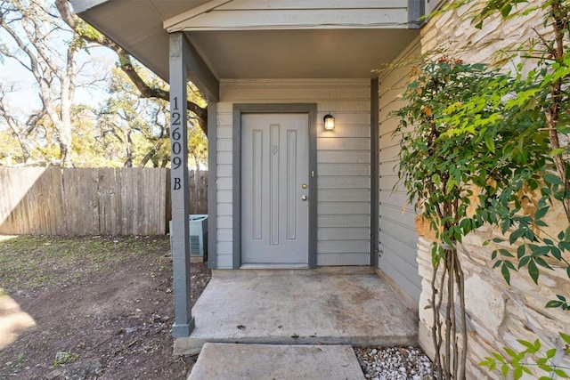 doorway to property featuring cooling unit