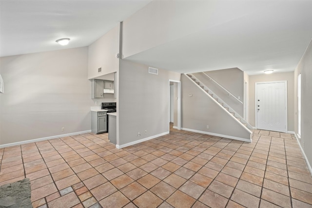 unfurnished living room featuring light tile patterned flooring