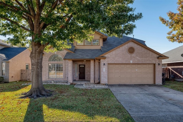 view of front of property featuring a garage and a front lawn