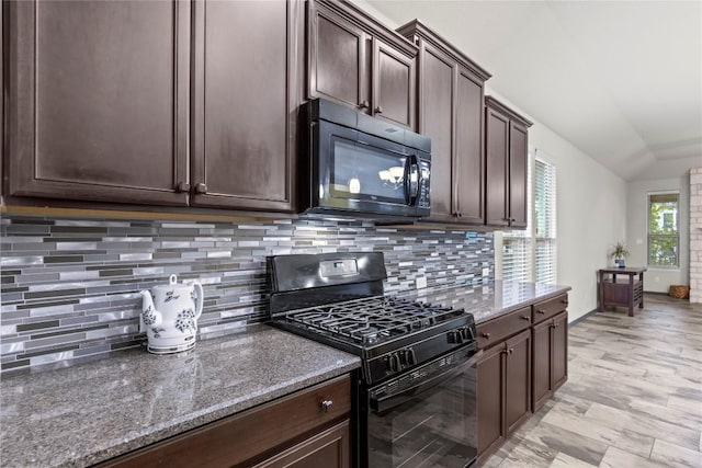 kitchen with dark brown cabinetry, decorative backsplash, black appliances, and stone countertops