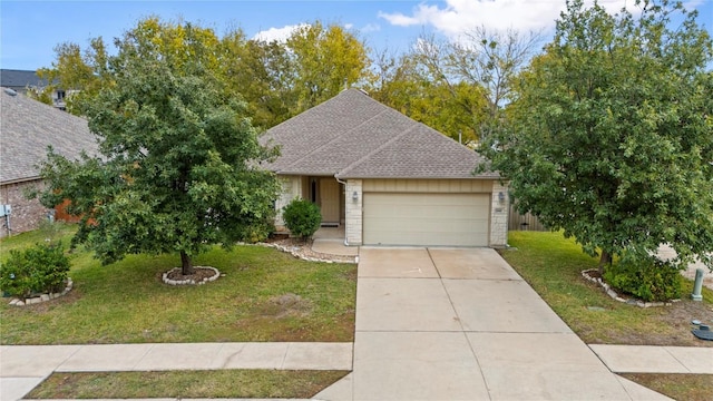 view of front of property featuring a front yard and a garage