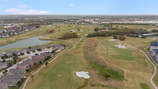 drone / aerial view with a water view, view of golf course, and a residential view