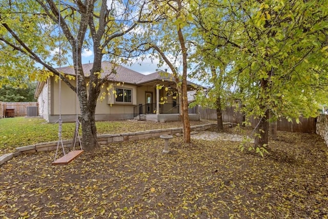 back of house featuring a sunroom