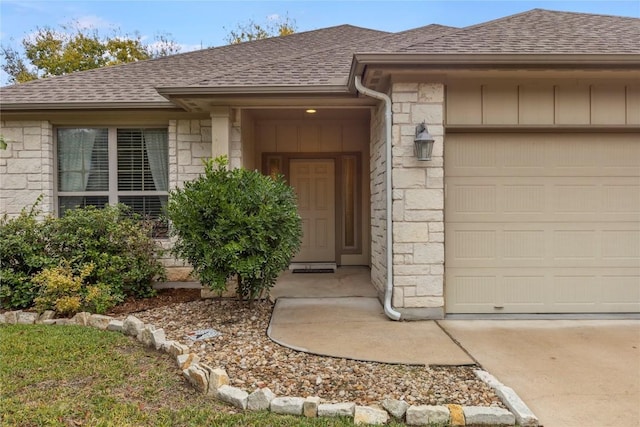 doorway to property featuring a garage