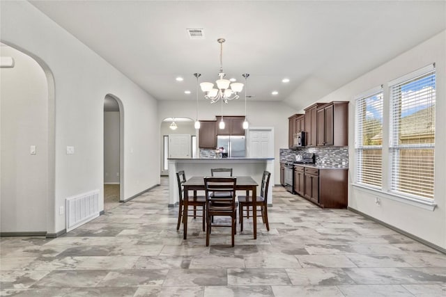 dining room featuring a chandelier