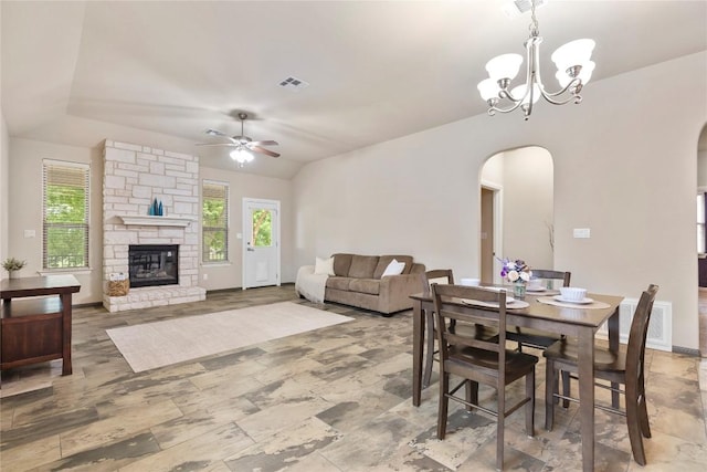 dining space featuring visible vents, arched walkways, and a wealth of natural light