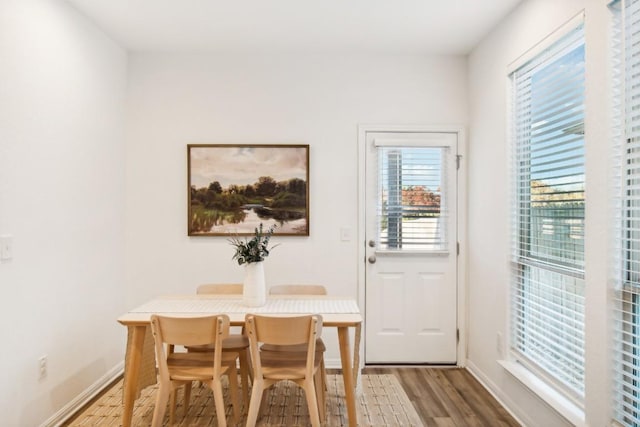 dining area with hardwood / wood-style flooring