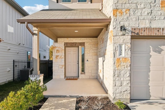 view of exterior entry with a garage