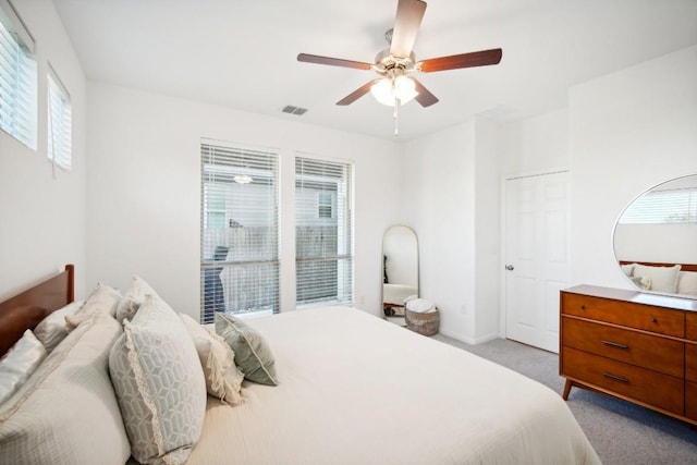 carpeted bedroom featuring ceiling fan