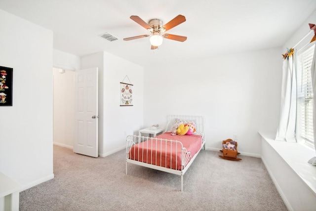 bedroom with ceiling fan and carpet floors